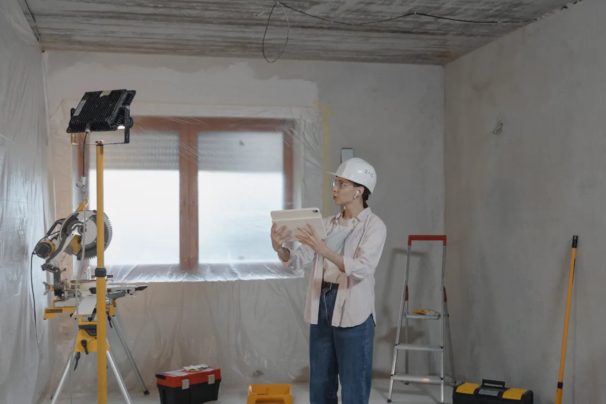 Property maintenance professional evaluating a residential property