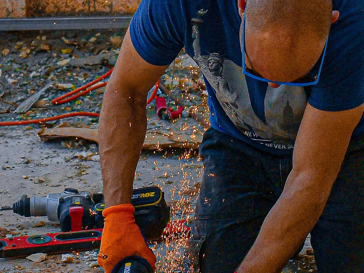 Skilled trade professional safely operating a power tool