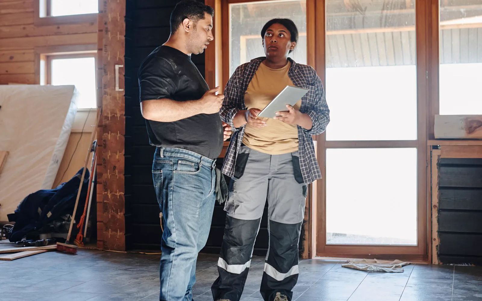 Contractors reviewing renovation plans together