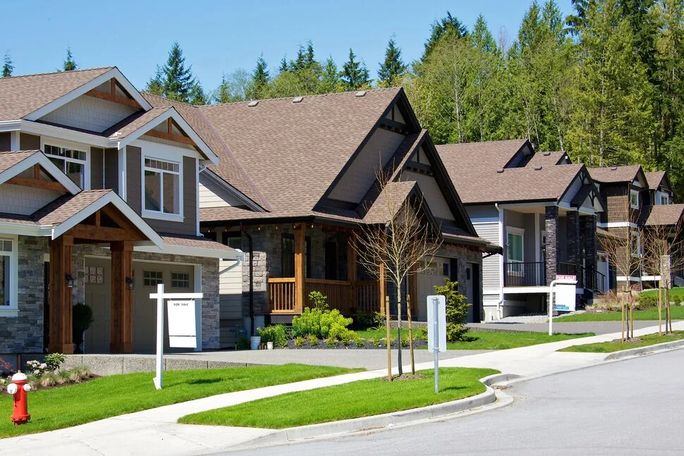 Suburban home with well-maintained lawn representing property preservation services